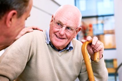 Adult man talking to aging parent about assisted living